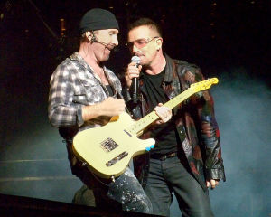 Bono and The Edge of U2 at Gillette Stadium, Foxboro, MA 9/21/2009. Photo via Wikipedia Commons by xrayspx.